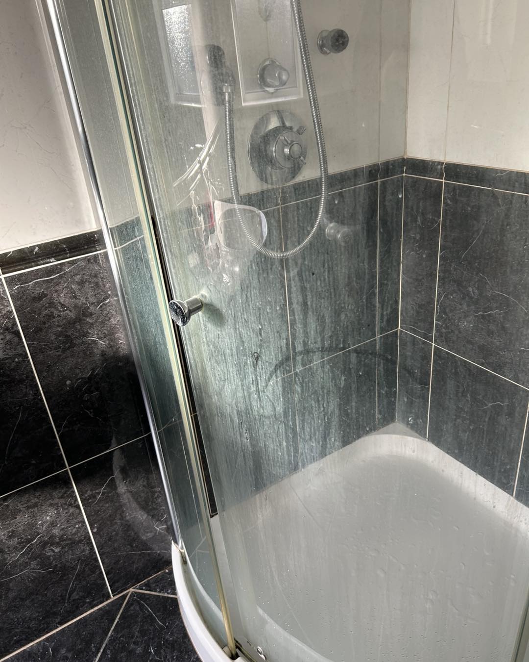 dirty unclean shower glass window before cleaning