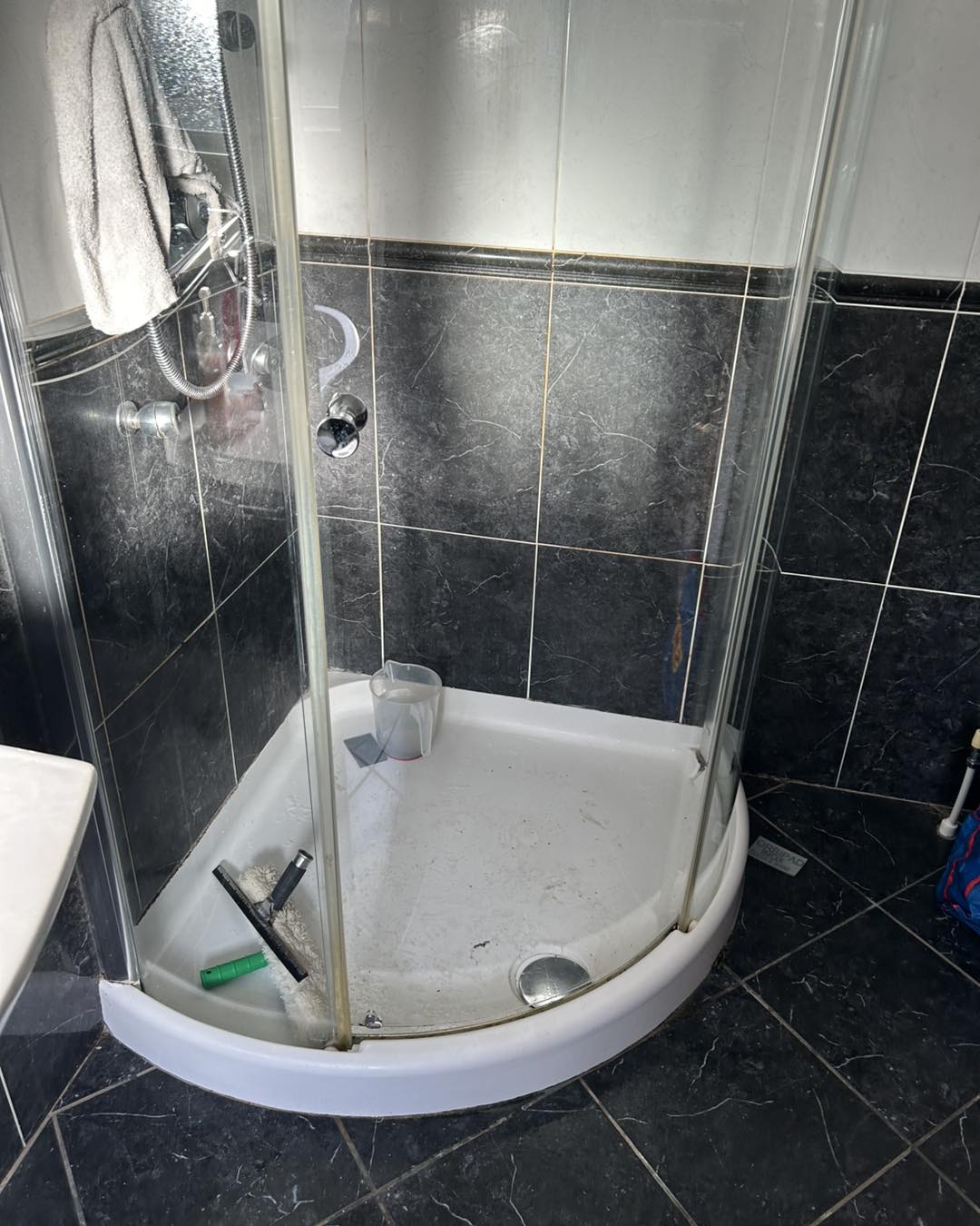 shower in process of full cleaning service by Neil's Cleaning
