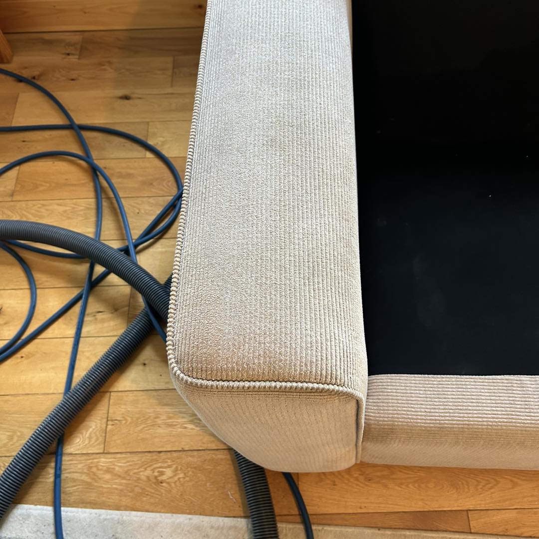 upholstering complete on dirty sofa arm